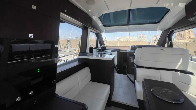  Yacht Photos Pics 2024 Galeon 410 HTC yacht interior with modern design and panoramic windows.