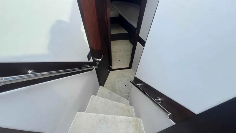  Yacht Photos Pics Staircase inside 2024 Galeon 410 HTC yacht, featuring sleek design and modern finishes.