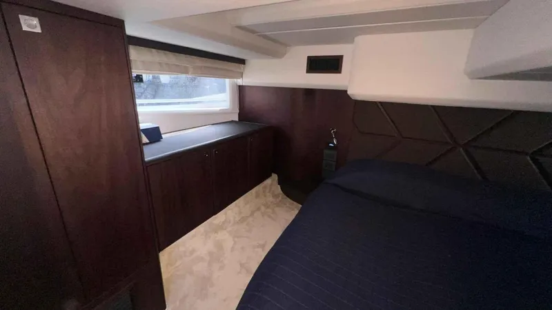  Yacht Photos Pics Luxurious interior of 2024 Galeon 410 HTC yacht cabin with dark wood and modern design.