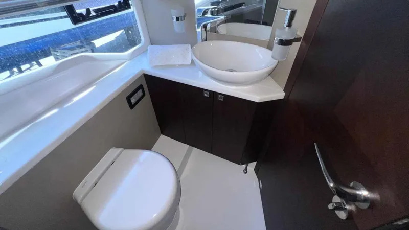  Yacht Photos Pics Modern bathroom in 2024 Galeon 410 HTC yacht with sleek fixtures and elegant design.