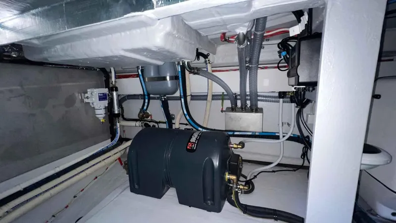  Yacht Photos Pics Engine room of 2024 Galeon 410 HTC yacht, showcasing mechanical components and piping.