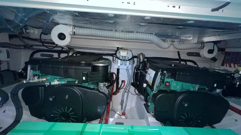  Yacht Photos Pics Engine room of 2024 Galeon 410 HTC yacht, showcasing dual engines and mechanical components.