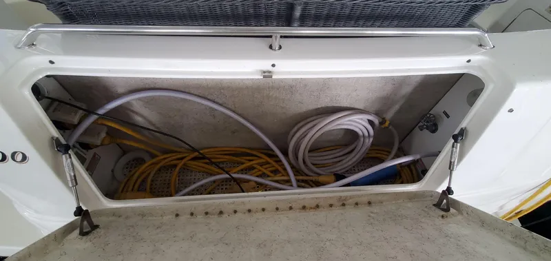 Callie B Yacht Photos Pics Storage compartment with cables on a 2001 Sea Ray 400 Sedan Bridge.
