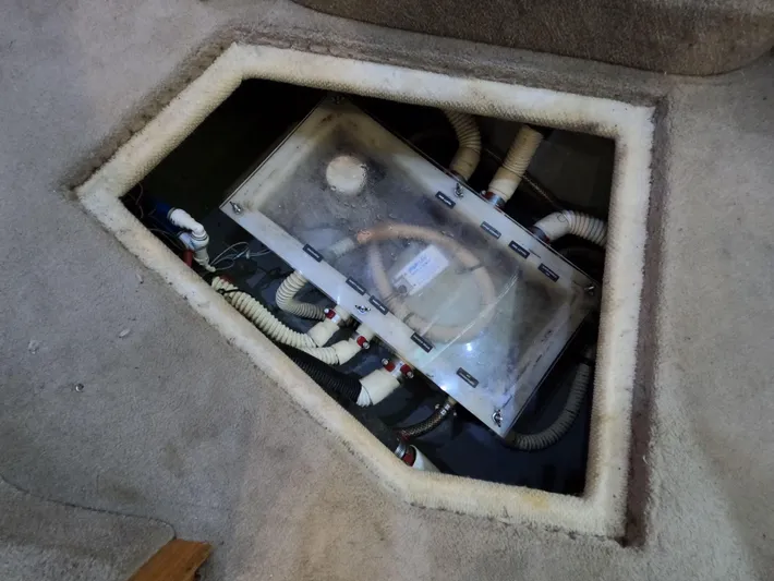 Callie B Yacht Photos Pics Access panel of 2001 Sea Ray 400 Sedan Bridge, showing internal wiring and components.