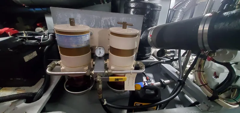 Callie B Yacht Photos Pics Engine room of 2001 Sea Ray 400 Sedan Bridge with dual fuel filters and gauge.