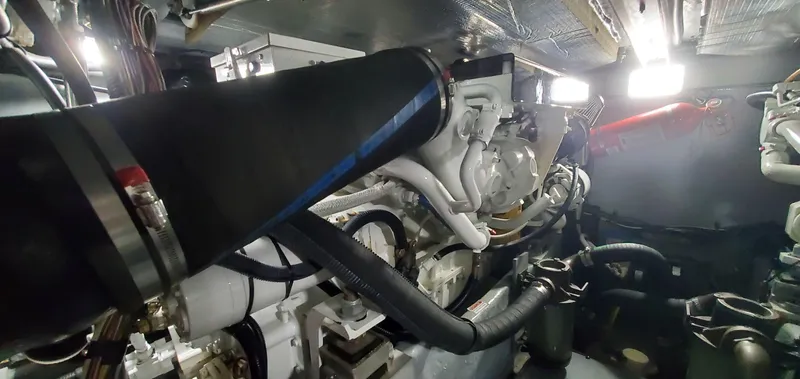 Callie B Yacht Photos Pics Engine room of 2001 Sea Ray 400 Sedan Bridge yacht, showcasing mechanical components.