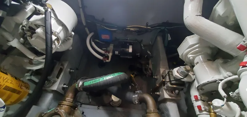 Callie B Yacht Photos Pics Engine room of 2001 Sea Ray 400 Sedan Bridge with visible components and piping.