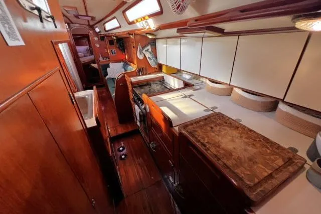 Unicorn Yacht Photos Pics Interior of 1988 Hylas Custom 44 yacht with wooden cabinetry and modern amenities.