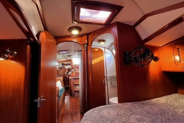 Unicorn Yacht Photos Pics Interior of 1988 Hylas Custom 44 yacht with wooden finish and cozy cabin.