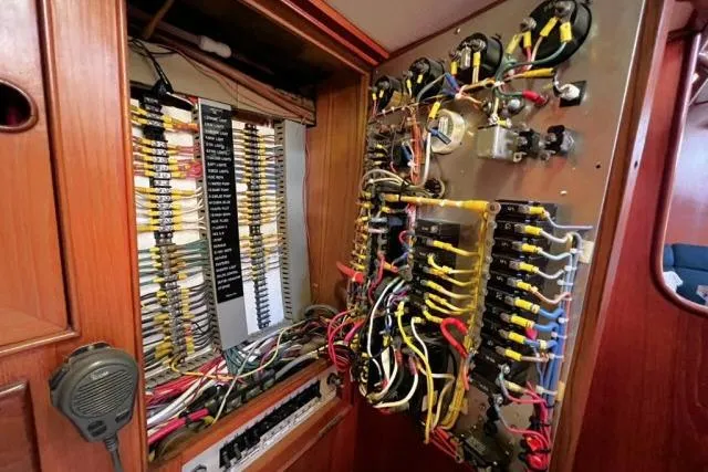 Unicorn Yacht Photos Pics Electrical panel of 1988 Hylas Custom 44 sailboat with complex wiring and components.