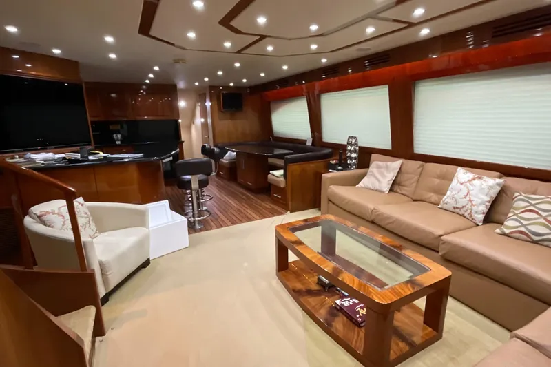 Temptation Yacht Photos Pics Luxurious interior of 2008 Hatteras 77 Convertible yacht with modern furnishings.