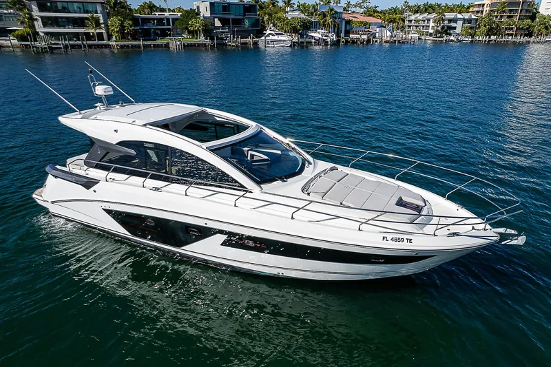 Beygu002f122 Yacht Photos Pics 2022 Beneteau Gran Turismo 45 yacht on serene water, modern design, luxury boating.