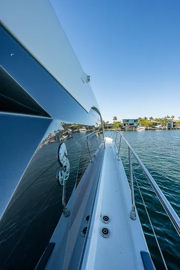 Beygu002f122 Yacht Photos Pics 2022 Beneteau Gran Turismo 45 yacht on serene water, side view.