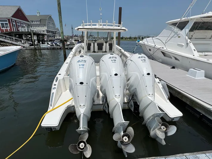  Yacht Photos Pics 2022 Pursuit S 378 Sport boat with triple 425 V8 engines docked at marina.
