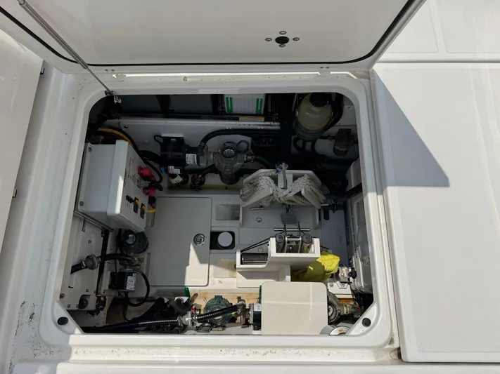  Yacht Photos Pics 2022 Pursuit S 378 Sport boat engine compartment with various mechanical components.