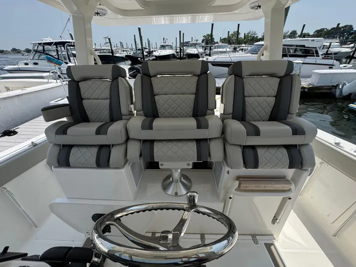  Yacht Photos Pics Luxury seating on 2022 Pursuit S 378 Sport boat at marina.
