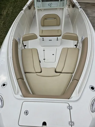  Yacht Photos Pics Interior view of a 2017 Sailfish 290 CC boat with beige seating.
