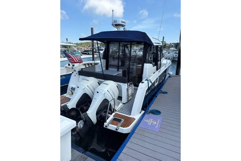  Yacht Photos Pics 2020 Jeanneau NC 895 boat docked, featuring twin Yamaha outboard engines.