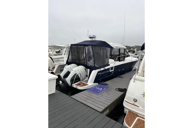  Yacht Photos Pics 2020 Jeanneau NC 895 boat docked at marina with twin outboard engines.