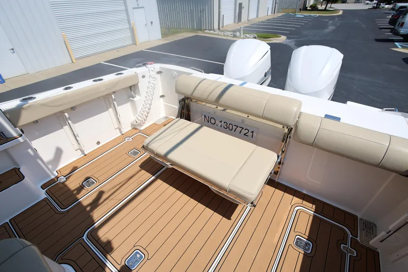  Yacht Photos Pics 2021 Pursuit OS 325 Offshore boat with teak deck and foldable seating.