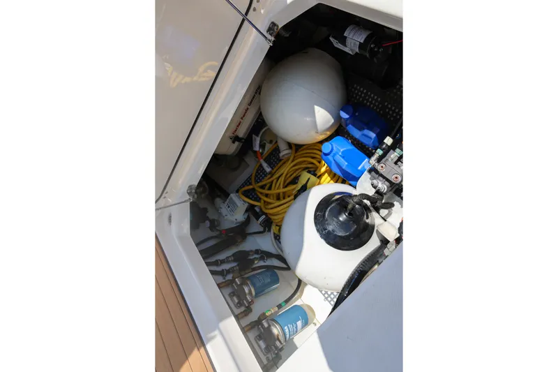  Yacht Photos Pics 2021 Pursuit OS 325 Offshore storage compartment with equipment and supplies.