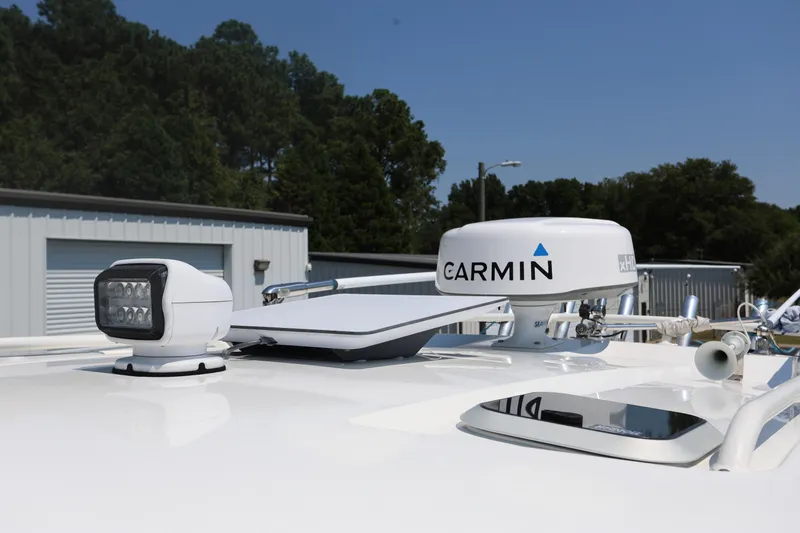  Yacht Photos Pics 2021 Pursuit OS 325 Offshore boat with Garmin radar and spotlight on deck.