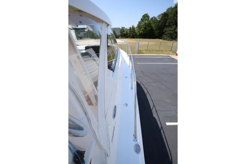  Yacht Photos Pics 2021 Pursuit OS 325 Offshore boat side view, parked outdoors.