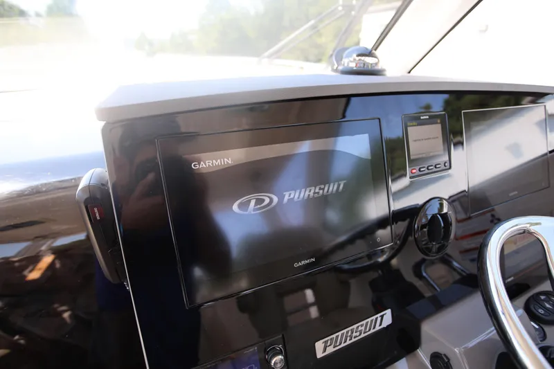  Yacht Photos Pics Dashboard of 2021 Pursuit OS 325 Offshore boat with Garmin navigation system.