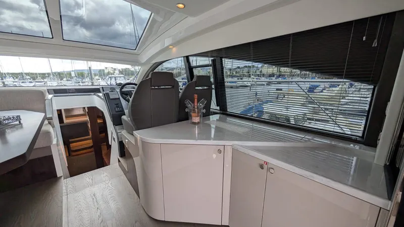 In Stock Yacht Photos Pics Interior of 2025 Fairline Targa 45 GT yacht, featuring modern design and marina view.