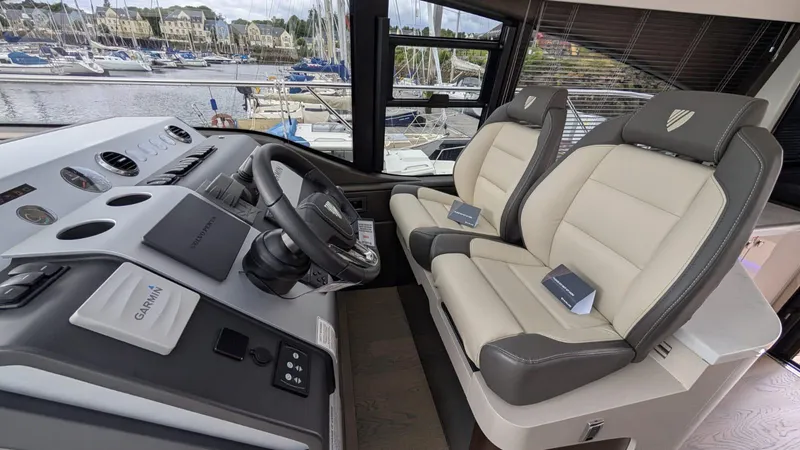 In Stock Yacht Photos Pics Interior of 2025 Fairline Targa 45 GT yacht with modern helm and seating.