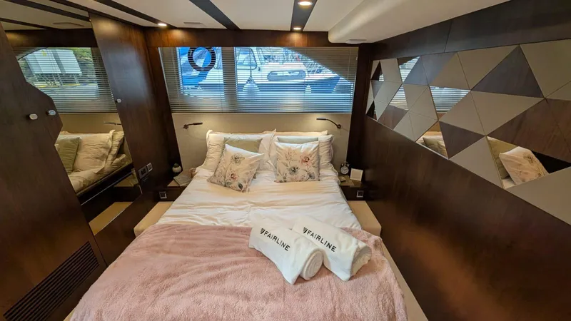 In Stock Yacht Photos Pics Luxurious bedroom interior of 2025 Fairline Targa 45 GT yacht with modern design elements.