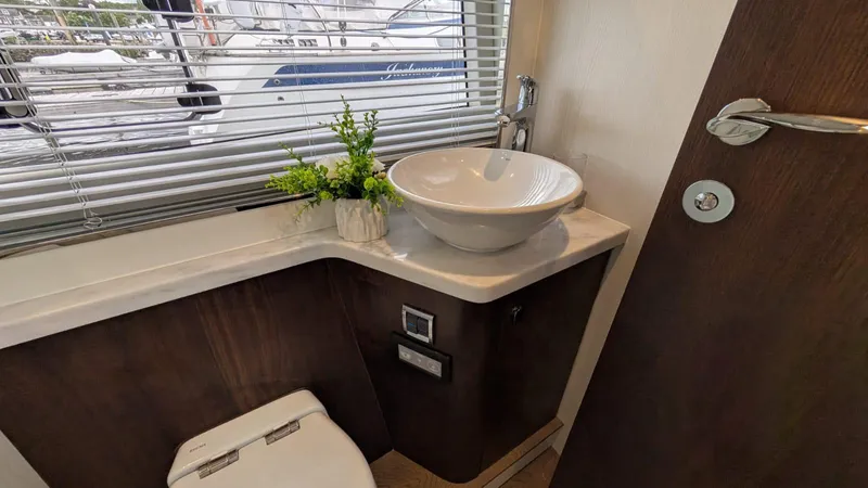 In Stock Yacht Photos Pics Bathroom interior of 2025 Fairline Targa 45 GT yacht with modern sink and decor.