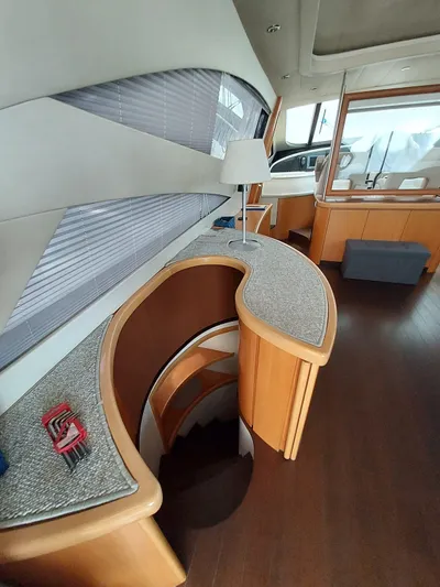  Yacht Photos Pics Interior of a 2005 Pershing 76 yacht with modern design and wooden accents.