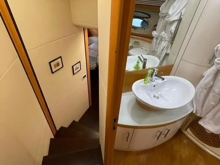  Yacht Photos Pics Luxurious bathroom and staircase in a 2005 Pershing 76 yacht interior.