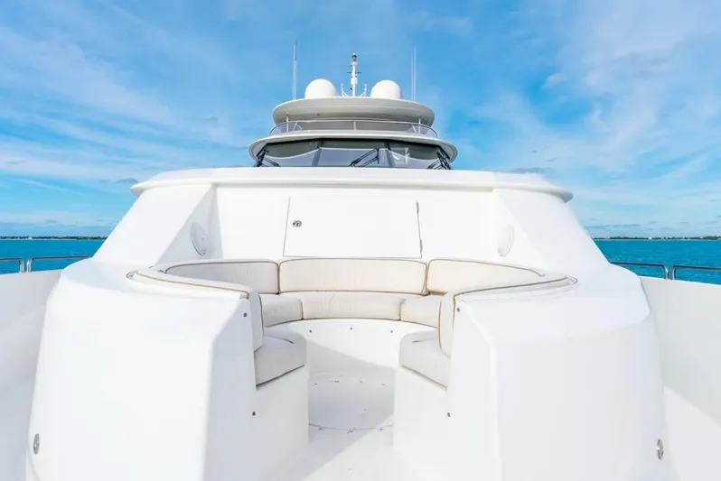 Simplicity Yacht Photos Pics Luxurious 2012 Westport 112 yacht deck with seating, under clear blue skies.