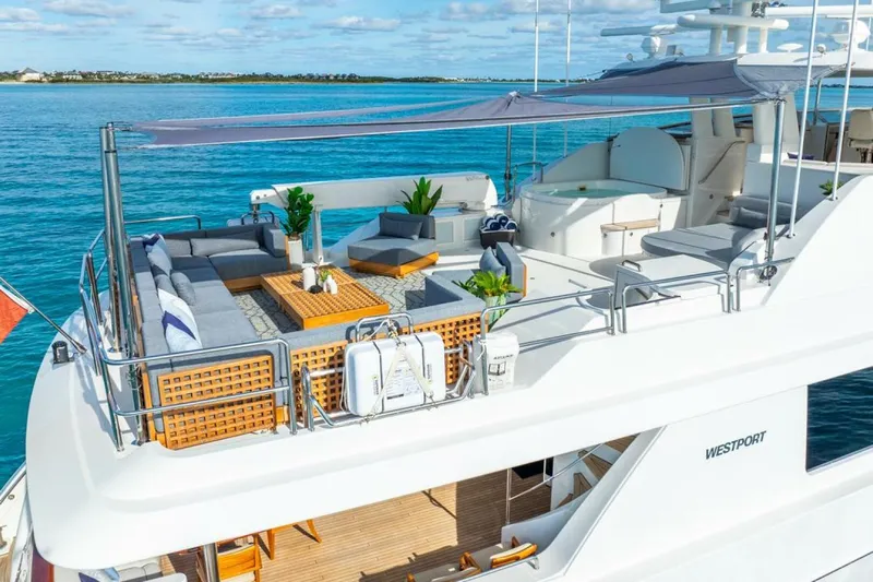 Simplicity Yacht Photos Pics Luxurious 2012 Westport 112 yacht with elegant deck seating and ocean view.