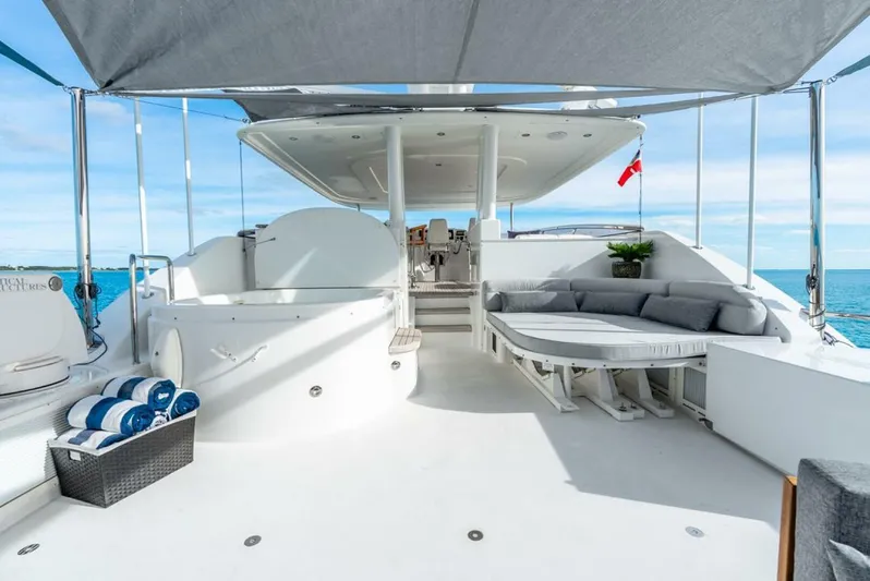 Simplicity Yacht Photos Pics Luxurious 2012 Westport 112 yacht deck with seating and ocean view.