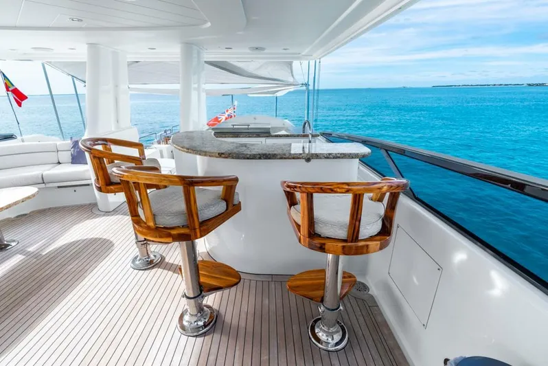 Simplicity Yacht Photos Pics Luxurious 2012 Westport 112 yacht deck with bar and ocean view.