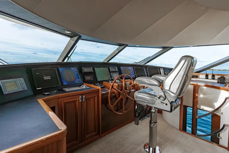 Simplicity Yacht Photos Pics Luxurious helm of 2012 Westport 112 yacht with modern navigation equipment and captain's chair.