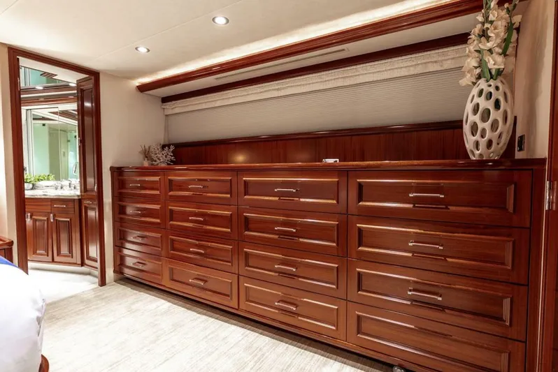 Simplicity Yacht Photos Pics Luxurious wooden cabinetry in a 2012 Westport 112 yacht interior, featuring elegant decor.