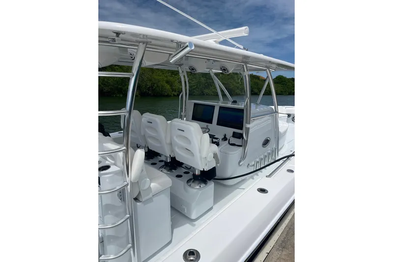  Yacht Photos Pics 2025 Contender 44 ST boat interior with modern seating and navigation equipment.