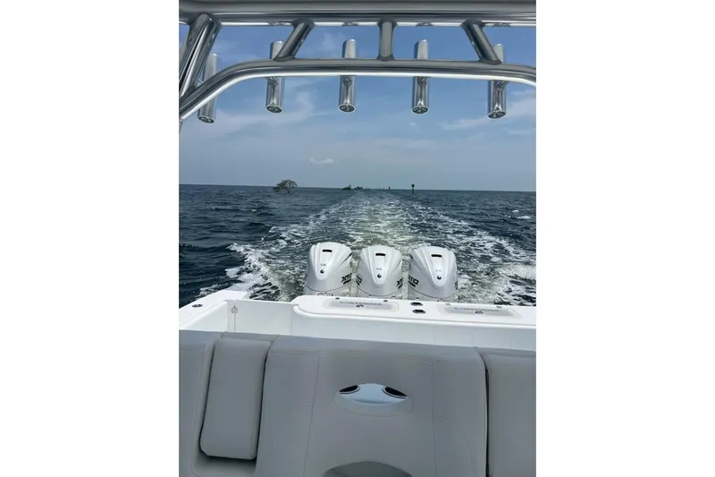  Yacht Photos Pics Contender 44 ST 2025 boat cruising on open water, showcasing powerful engines and sleek design.