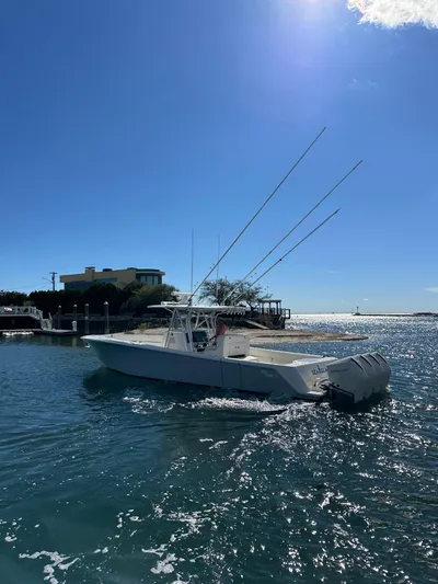Seaglass Yacht Photos Pics 2022 SeaVee 390B boat on water under clear blue sky.