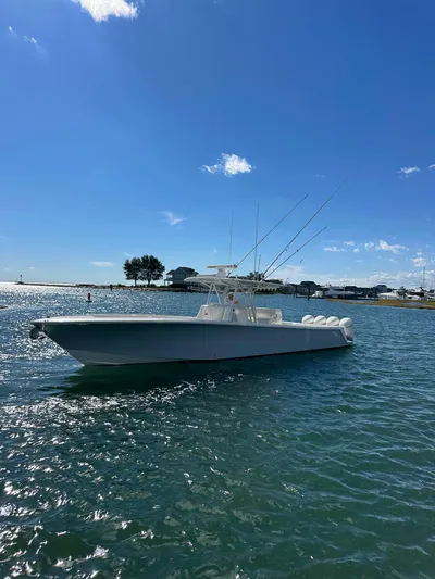 Seaglass Yacht Photos Pics 2022 SeaVee 390B boat on calm water under clear blue sky.