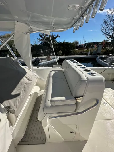 Seaglass Yacht Photos Pics 2022 SeaVee 390B boat interior with cushioned seating and rod holders.