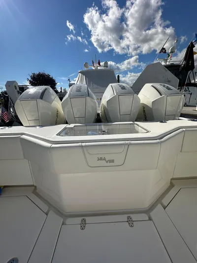 Seaglass Yacht Photos Pics 2022 SeaVee 390B boat with four powerful outboard engines under a bright blue sky.