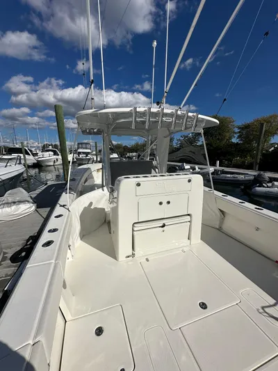 Seaglass Yacht Photos Pics 2022 SeaVee 390B boat docked under a clear blue sky with scattered clouds.