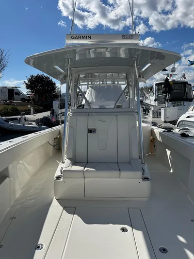 Seaglass Yacht Photos Pics 2022 SeaVee 390B boat with Garmin equipment, docked under a partly cloudy sky.