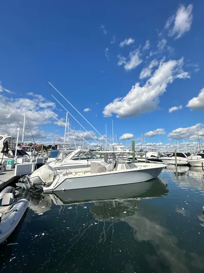 Seaglass Yacht Photos Pics 2022 SeaVee 390B boat docked in a marina under a clear blue sky.
