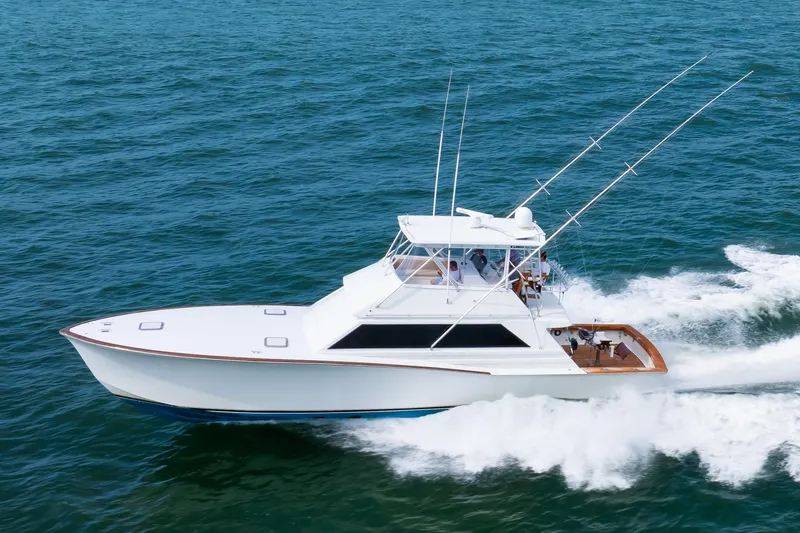 Spiros Yacht Photos Pics 1972 Jim Smith Custom Convertible yacht cruising on open water.